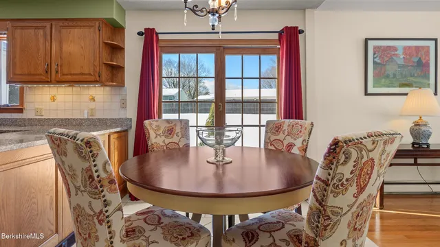 a dining room with furniture and window