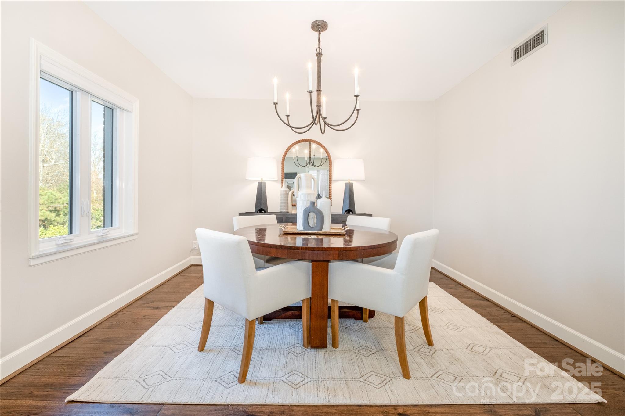 4527 Gaynor Road, Unit 303 Charlotte, NC 28211 - Photo 14 of 28 a view of a dining room with furniture window and wooden floor