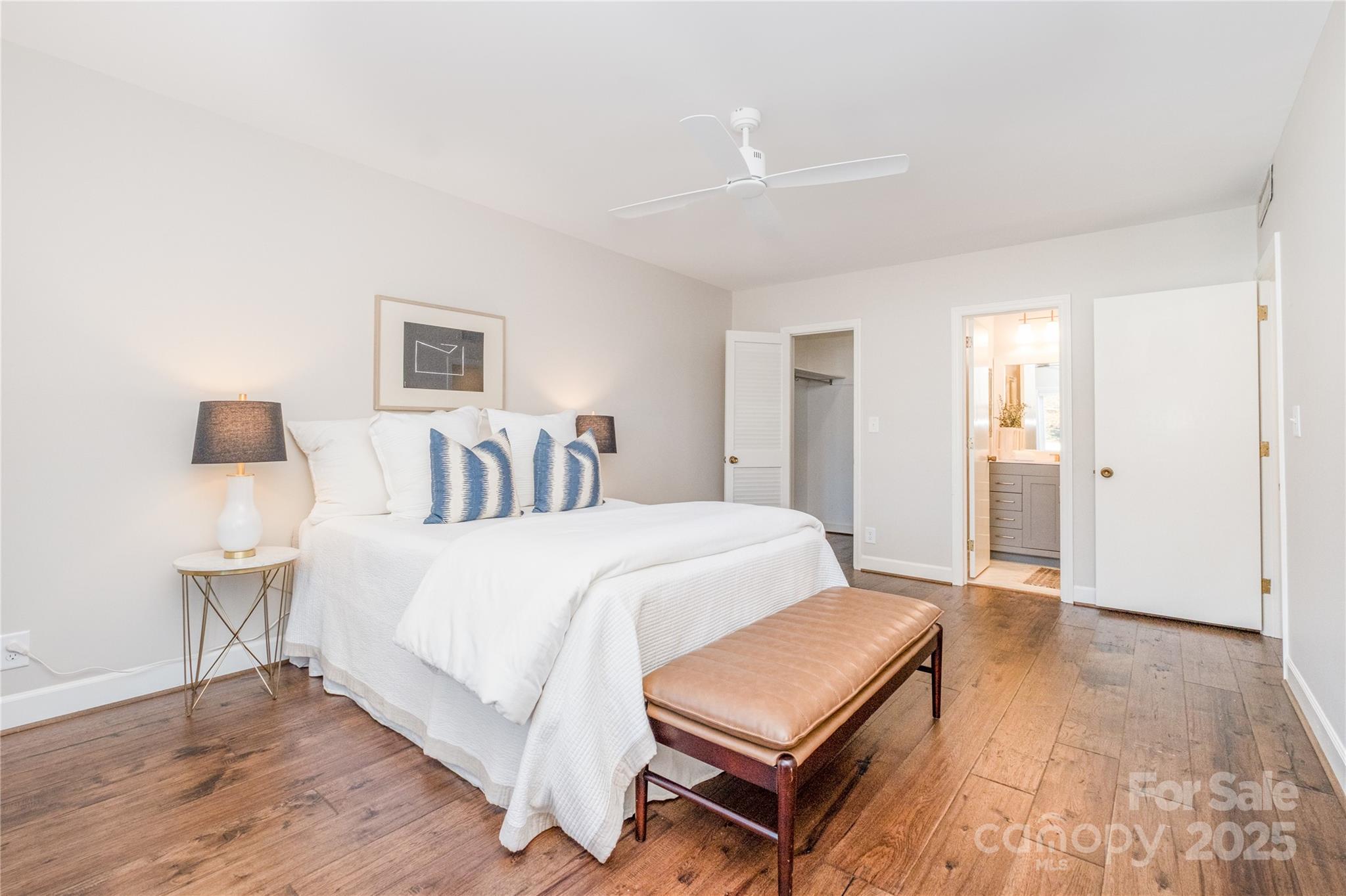 4527 Gaynor Road, Unit 303 Charlotte, NC 28211 - Photo 16 of 28 a bedroom with a bed and a table