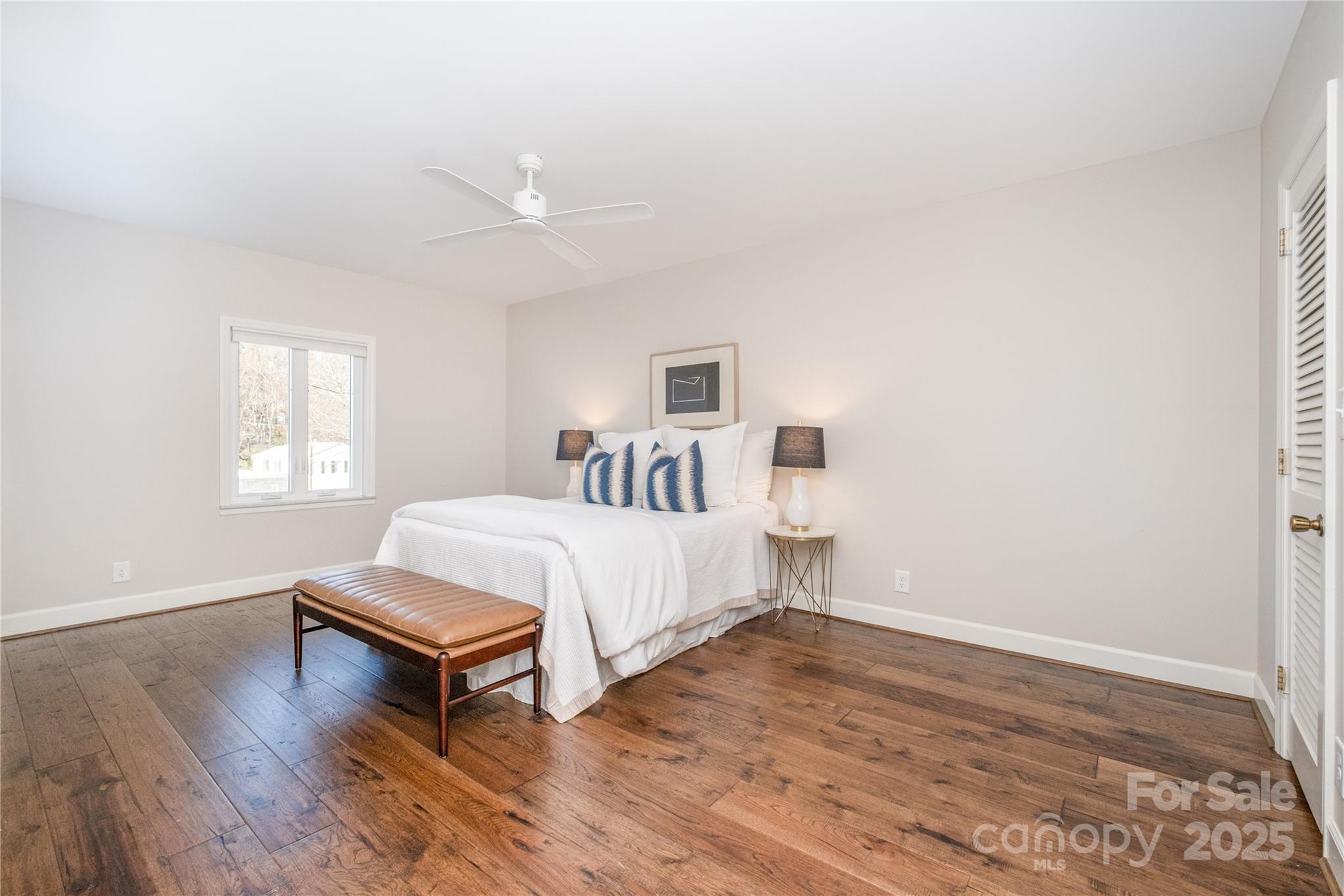 4527 Gaynor Road, Unit 303 Charlotte, NC 28211 - Photo 17 of 28 a bed room with a bed and a window