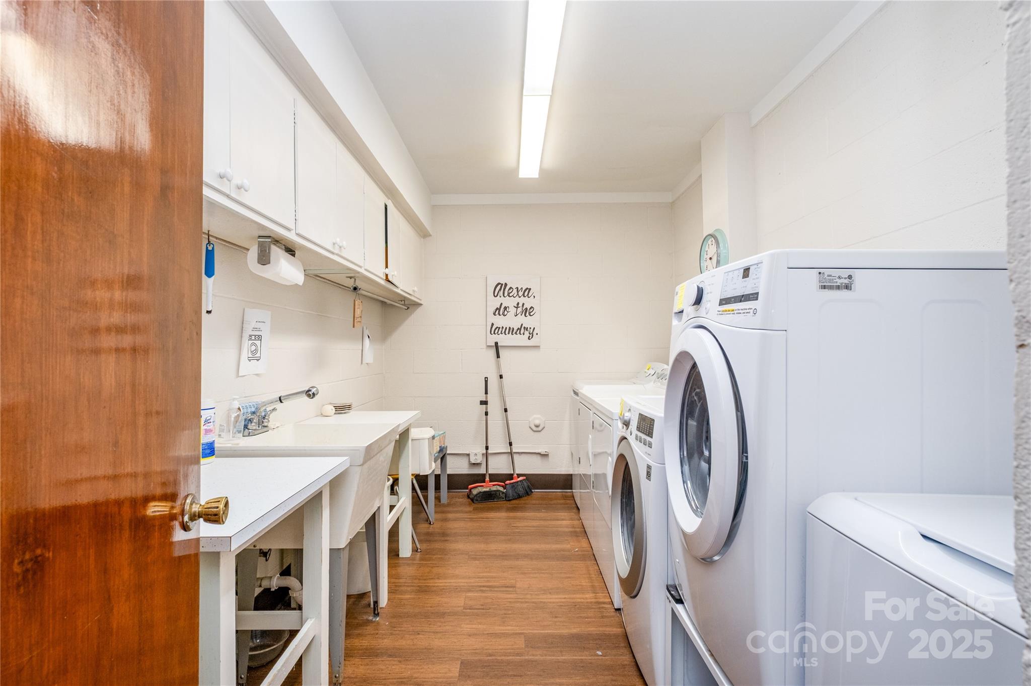 4527 Gaynor Road, Unit 303 Charlotte, NC 28211 - Photo 24 of 28 a bathroom with a sink a washer and dryer