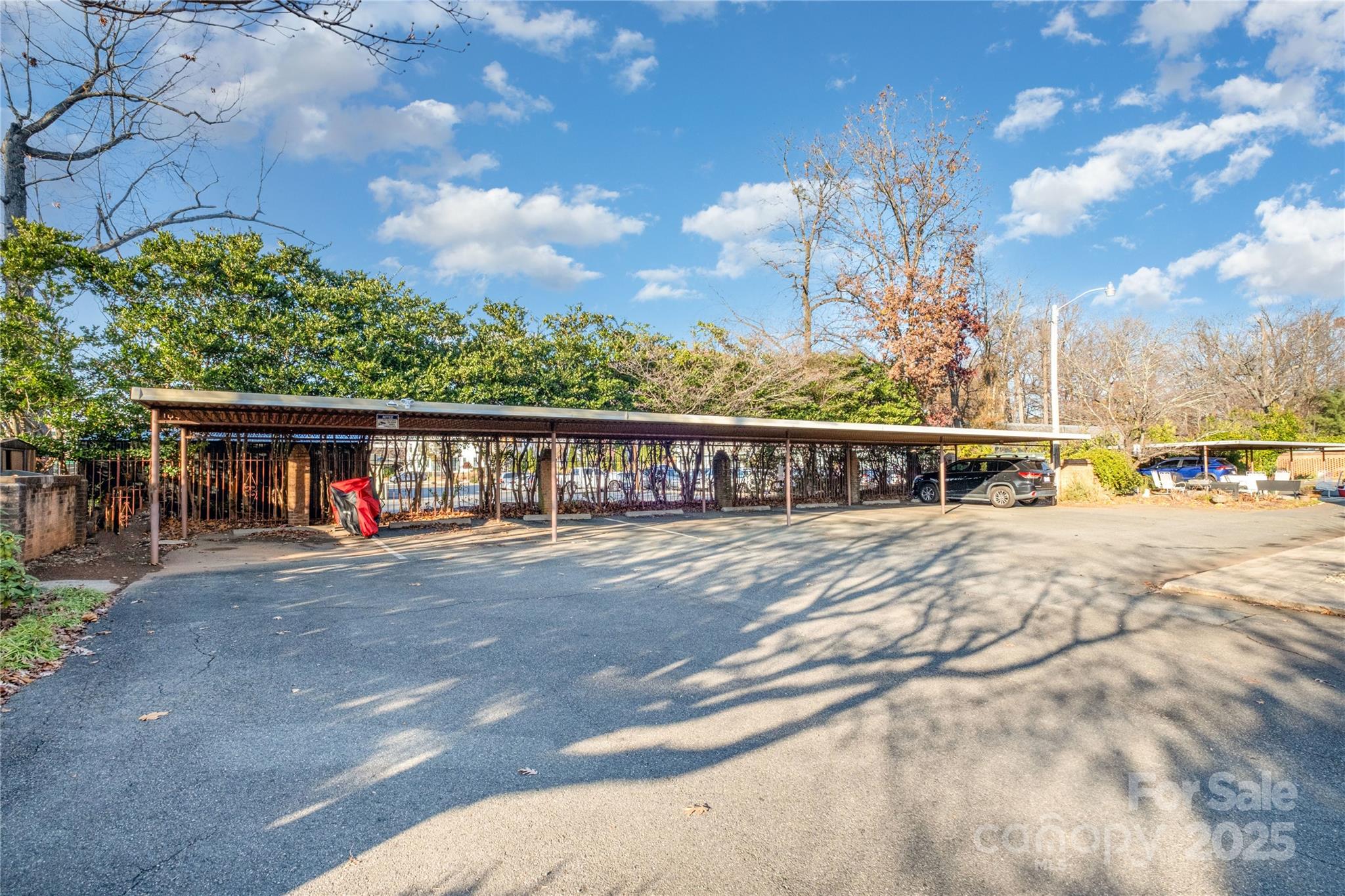 4527 Gaynor Road, Unit 303 Charlotte, NC 28211 - Photo 27 of 28 a view of a house with a yard