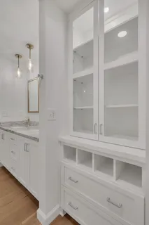 a bathroom with a double vanity sink and mirror