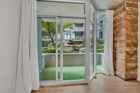 a view of a glass door and a window