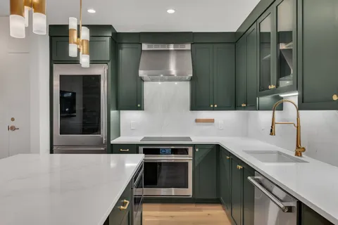 a kitchen with a sink and a refrigerator
