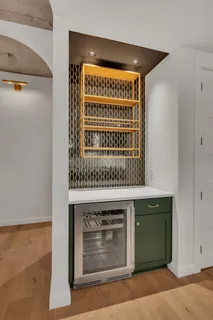 a view of kitchen with granite countertop window and front door
