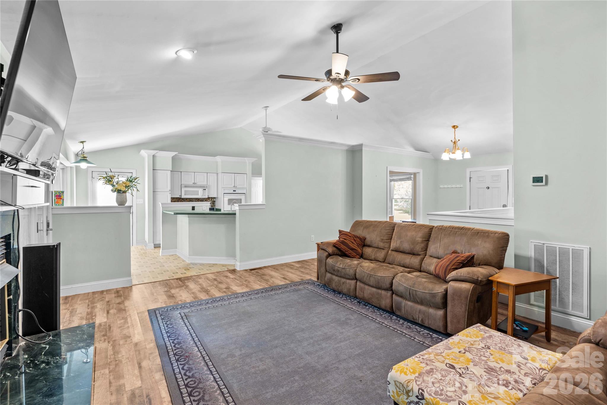 711 Spring Pointe Drive Stony Point, NC 28678 - Photo 7 of 47 a living room with furniture and kitchen view