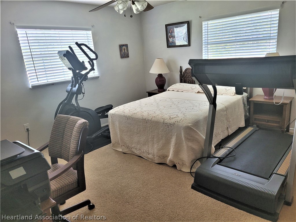 641 South Lakeview Road Lake Placid, FL 33852 - Photo 5 of 15 a room with gym equipment on wooden floor
