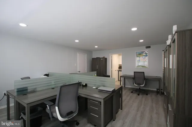 a view of a kitchen with a table and chairs