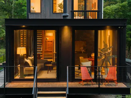 a view of yard with wooden fence and a bench