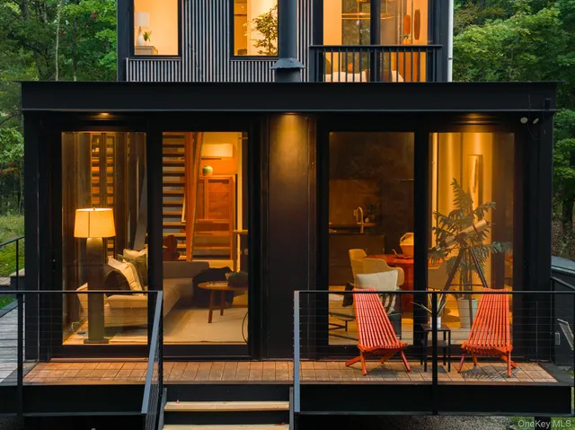 a view of yard with wooden fence and a bench
