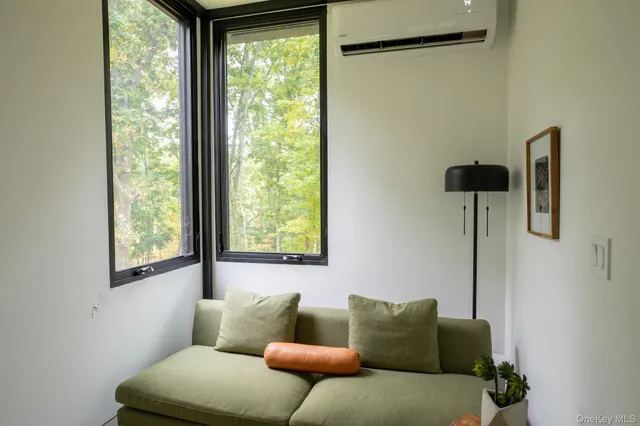 a dining table with chairs and window