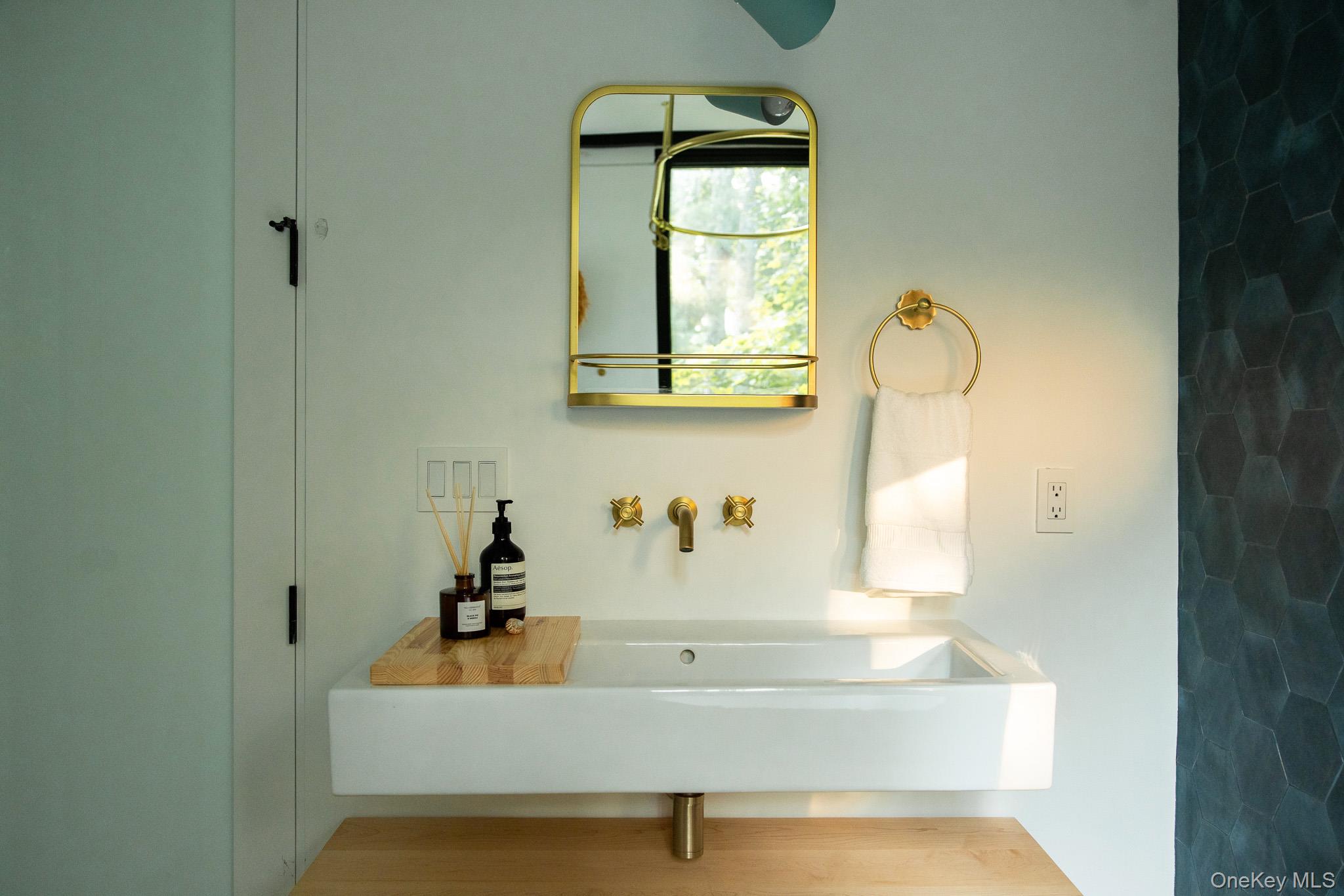283 Willow Glen Road Red Hook, NY 12571 - Photo 19 of 27 a bathroom with a sink and a mirror