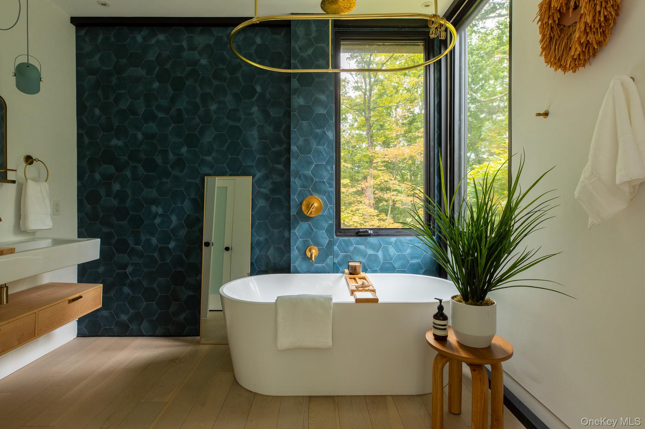 283 Willow Glen Road Red Hook, NY 12571 - Photo 20 of 27 a white bath tub sitting in a bathroom next to a window