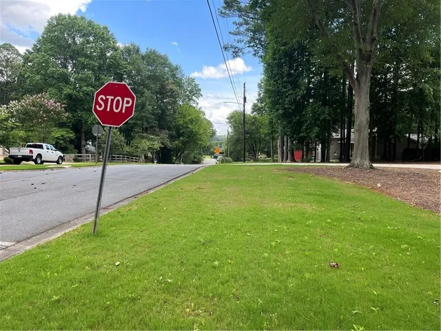 a view of a street with a sign board