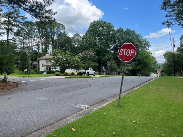 a sign board with a red sign board