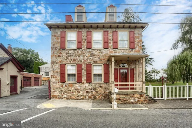 a front view of a house with a outdoor space