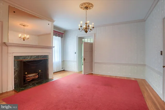 a bedroom with a bed and a fireplace