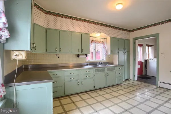 a view of a room with cabinet and mirrors