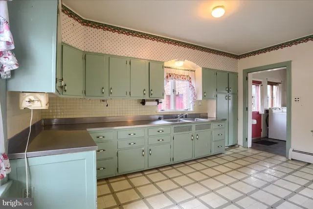 a view of a room with cabinet and mirrors