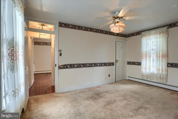 a view of an empty room with a window