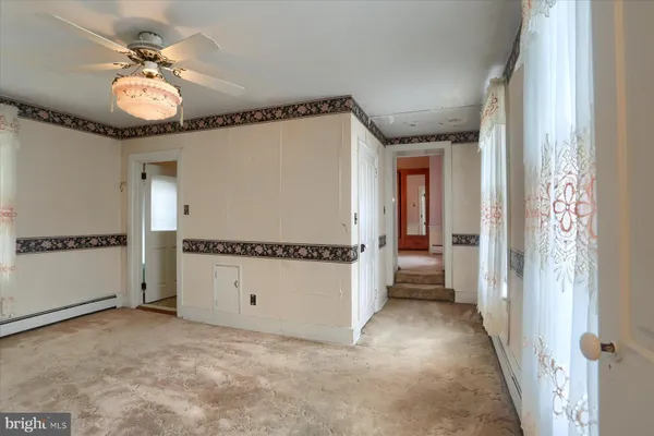 a view of a hallway with a chandelier