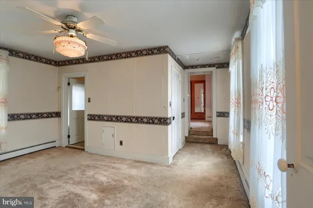 a view of a hallway with a chandelier