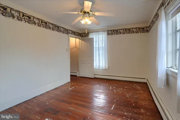 a view of entryway with wooden floor