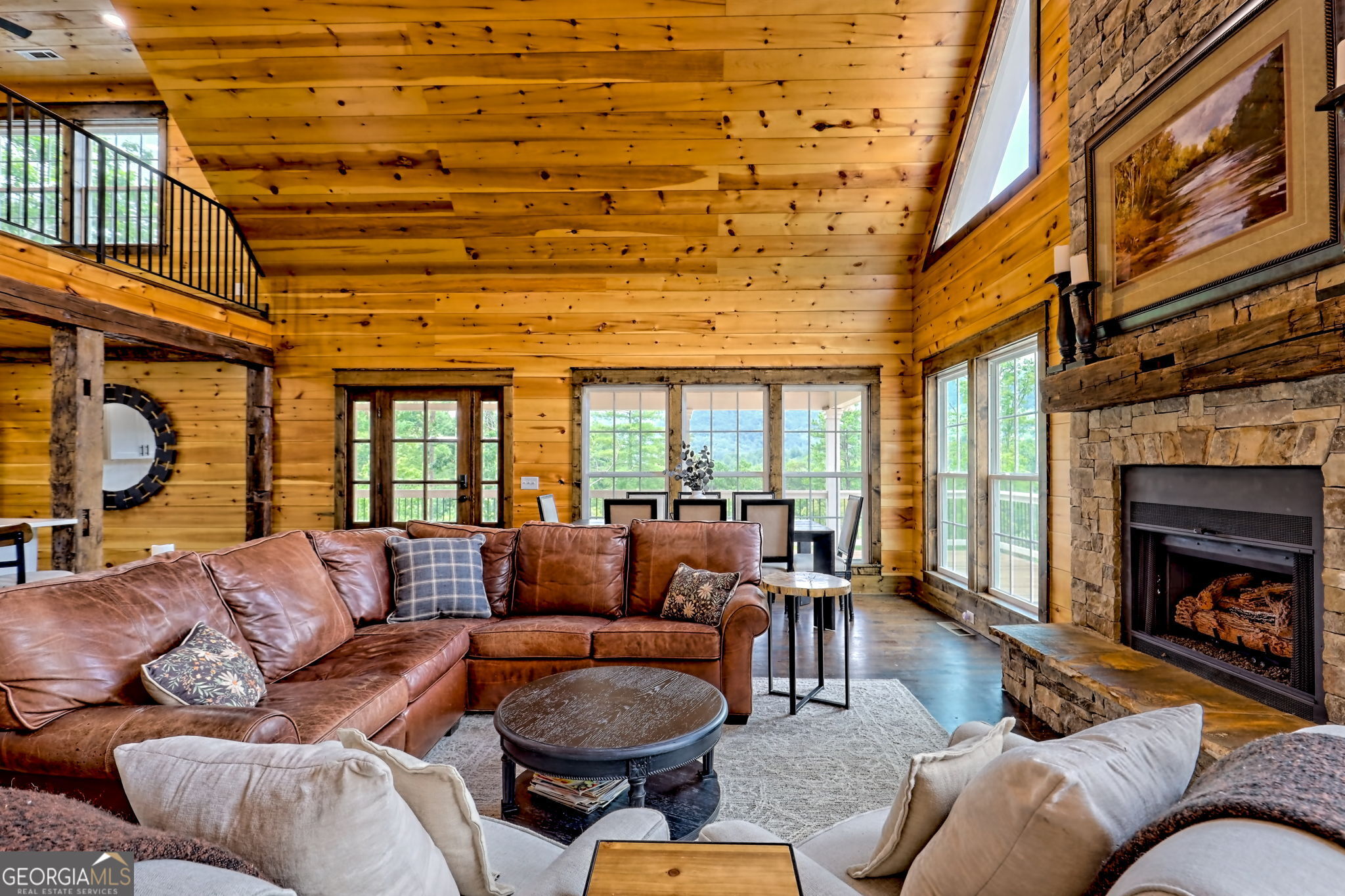 63 Redwood Lane Tiger, GA 30576 - Photo 16 of 84 a living room with furniture a fireplace and a large window