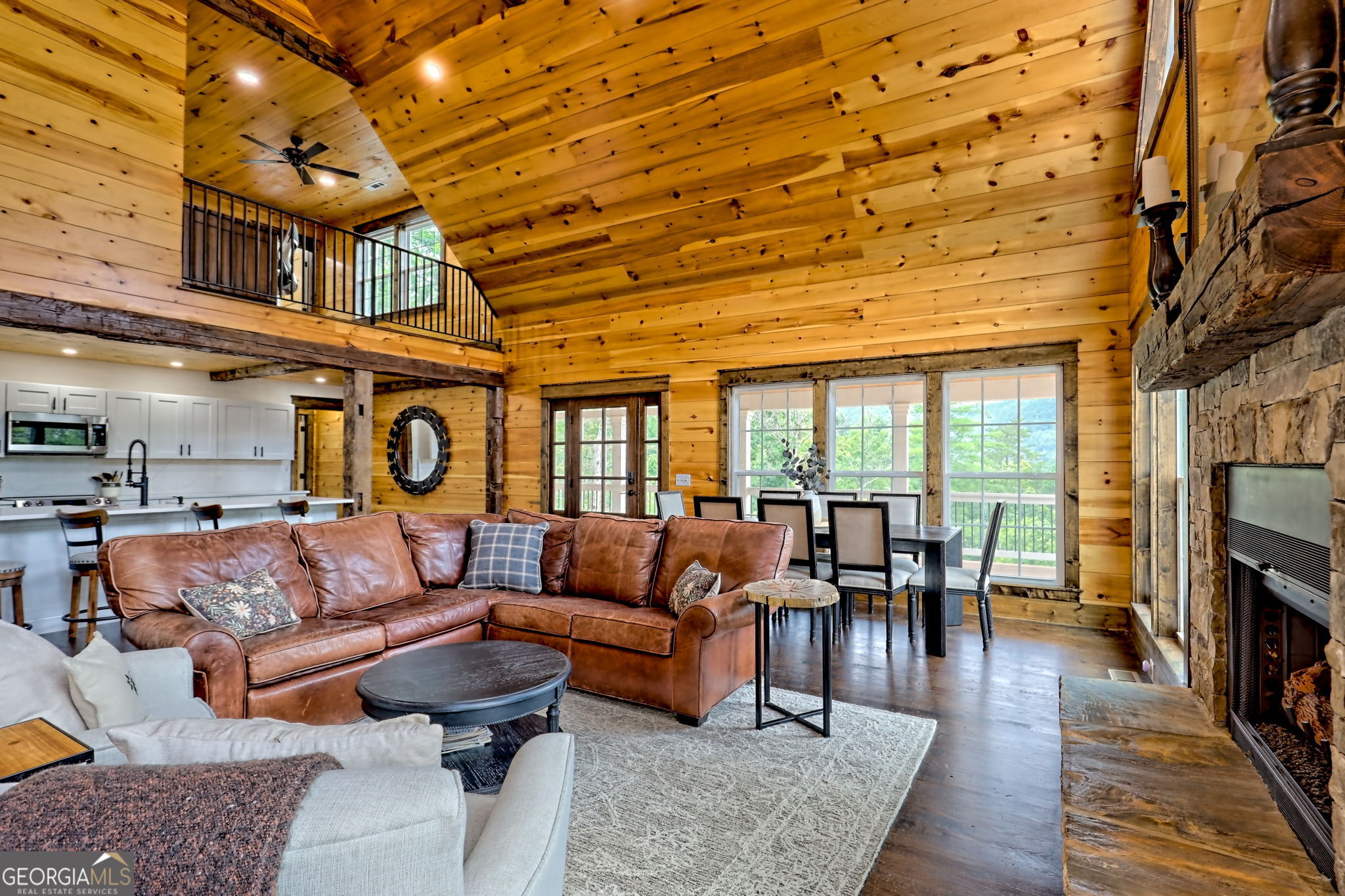 63 Redwood Lane Tiger, GA 30576 - Photo 18 of 84 a living room with furniture a fireplace and wooden floor