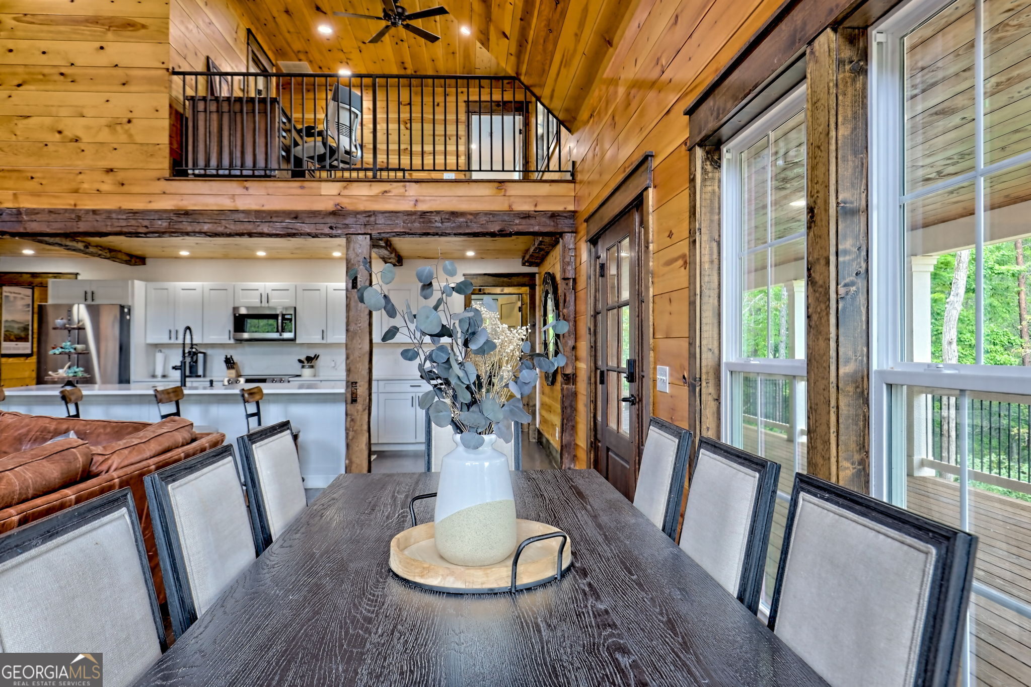 63 Redwood Lane Tiger, GA 30576 - Photo 19 of 84 a view of a dining room with furniture a chandelier and wooden floor