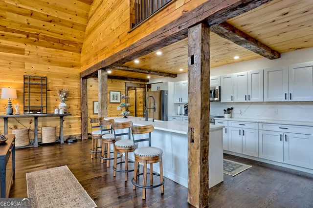 a spacious bedroom with two beds and a window