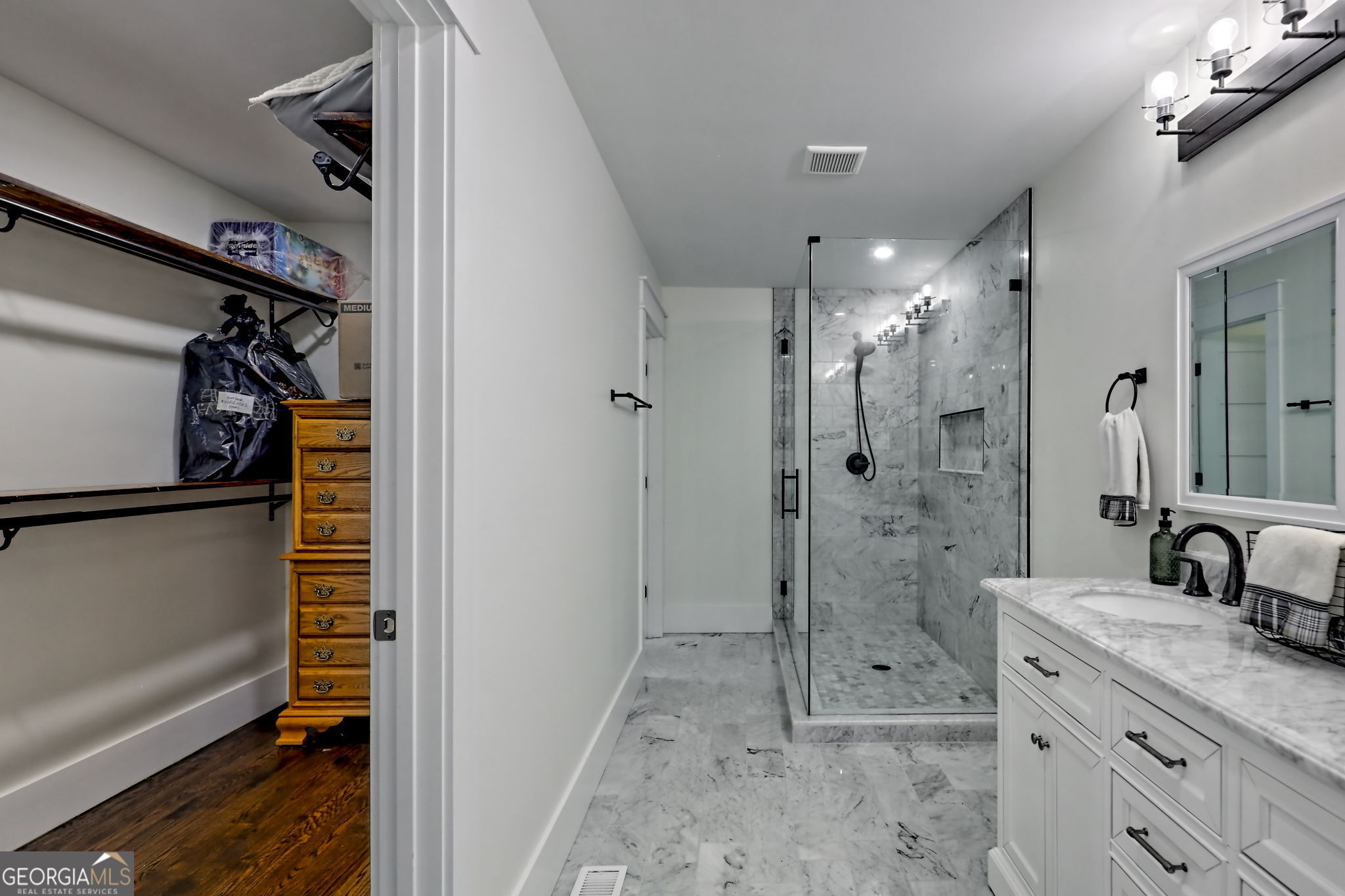 63 Redwood Lane Tiger, GA 30576 - Photo 32 of 84 a bathroom with a shower sink and mirror