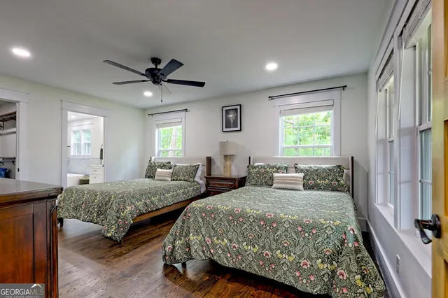 a bedroom with a large bed and a window