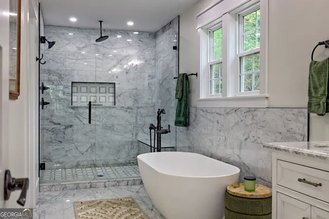 a backyard of a house with barbeque oven table and chairs