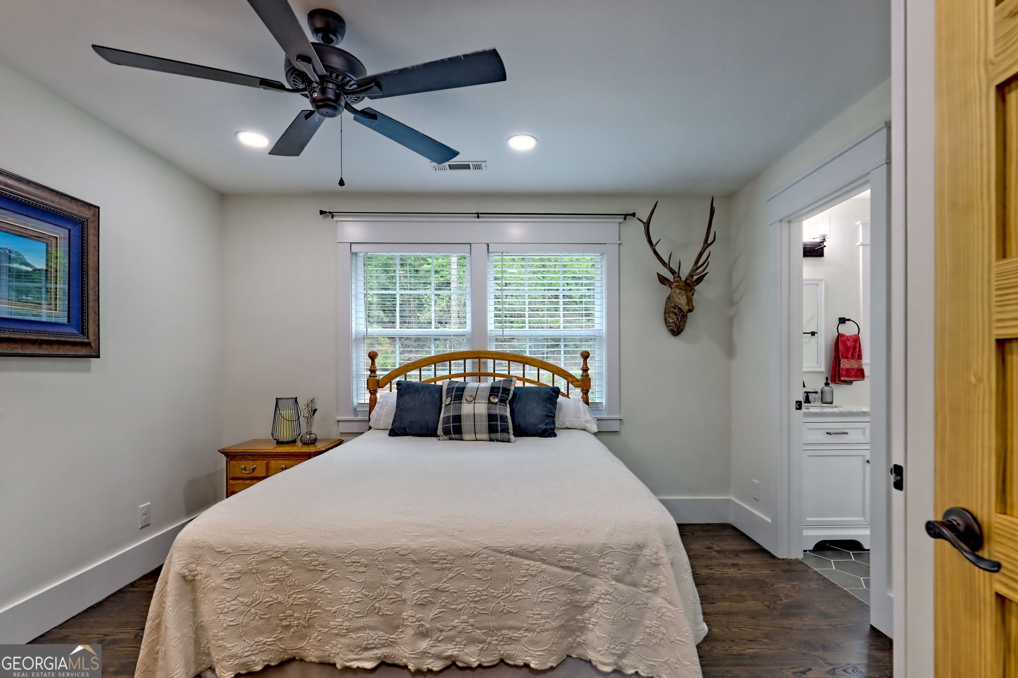 63 Redwood Lane Tiger, GA 30576 - Photo 55 of 84 a bedroom with a bed and a chandelier