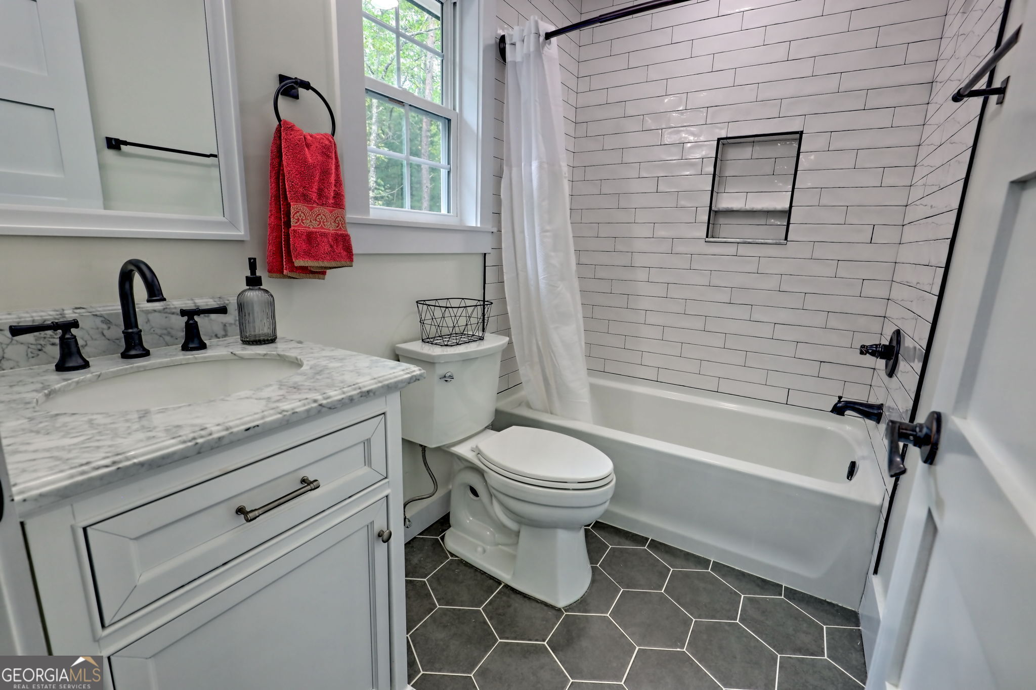 63 Redwood Lane Tiger, GA 30576 - Photo 58 of 84 a bathroom with a granite countertop toilet sink and mirror