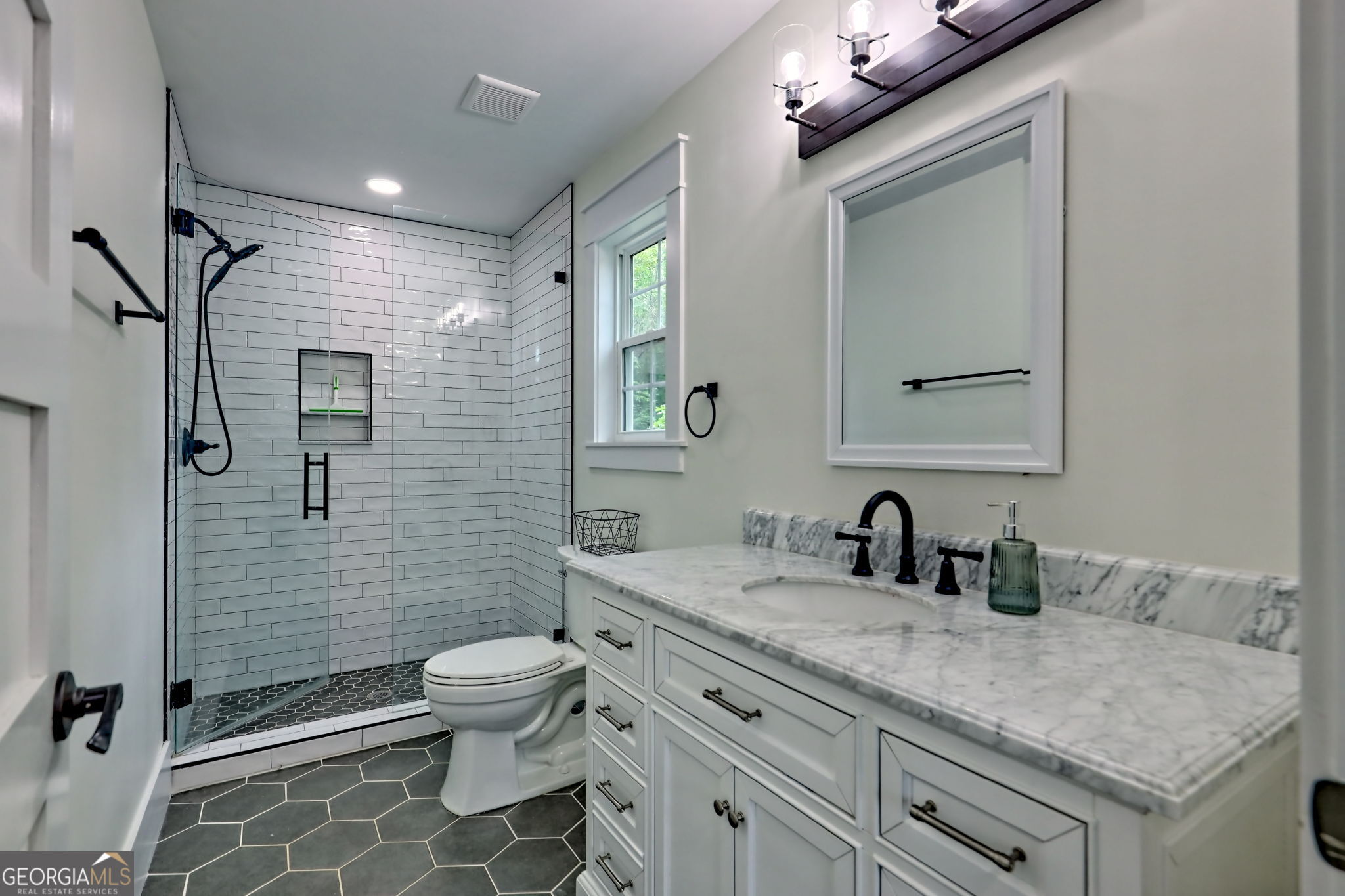 63 Redwood Lane Tiger, GA 30576 - Photo 63 of 84 a bathroom with a granite countertop sink toilet and shower