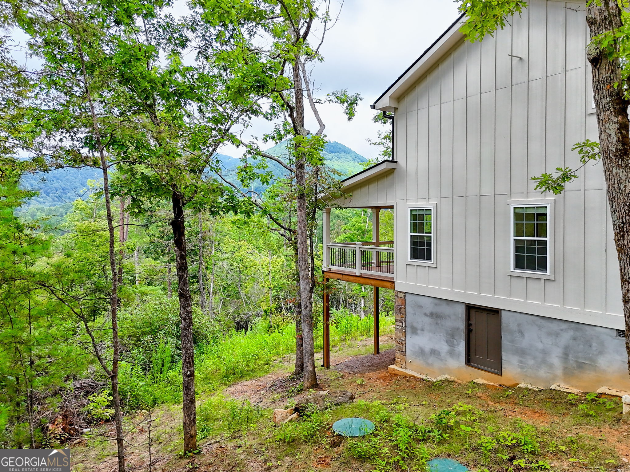63 Redwood Lane Tiger, GA 30576 - Photo 74 of 84 a backyard of a house with seating space