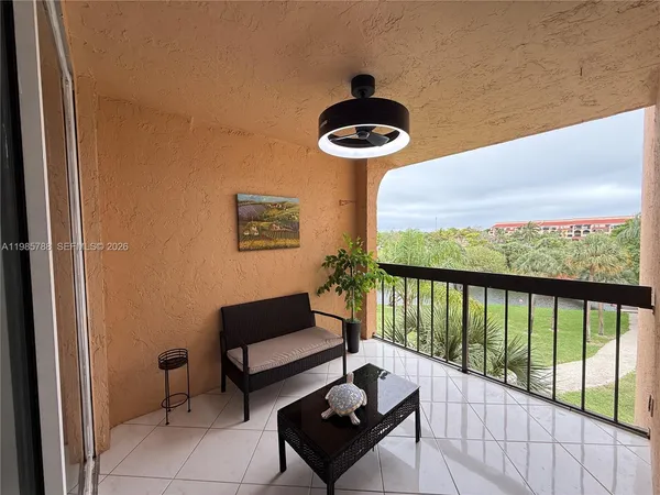 a view of a balcony with furniture