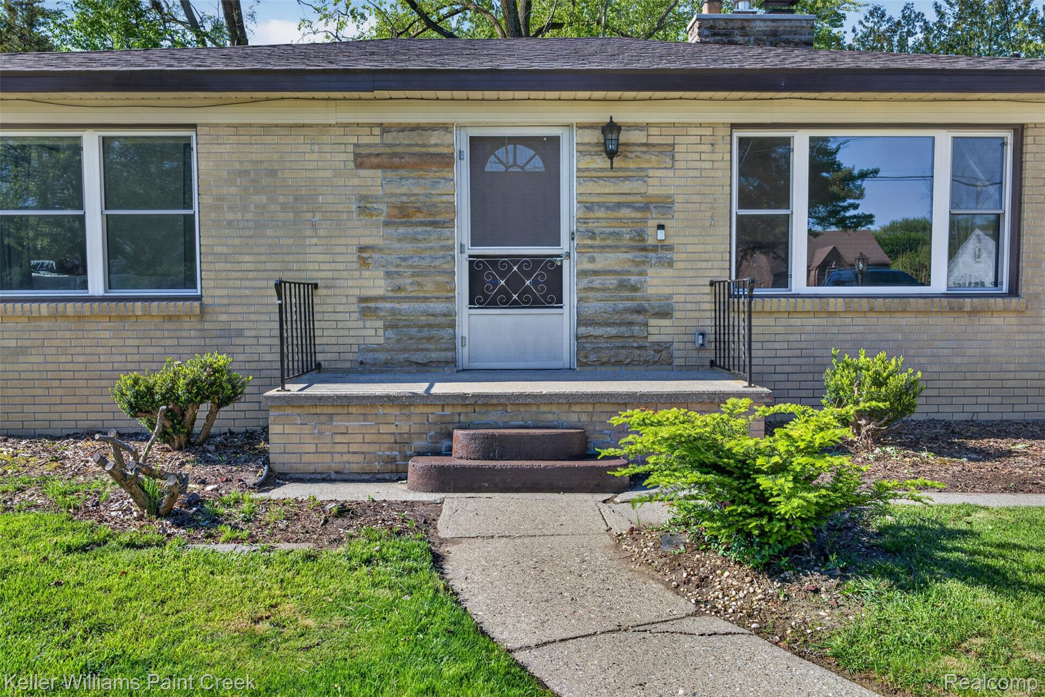 2942 Tatham Road Saginaw, MI 48601 - Photo 46 of 59 Entrance to property with a chimney and brick siding