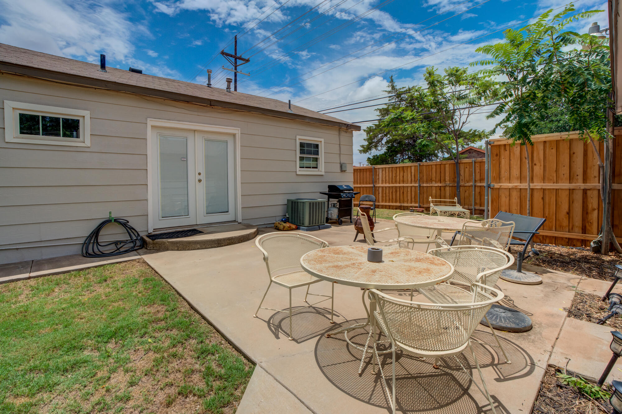 2826 33rd Street Lubbock, TX 79410 - Photo 33 of 33 a backyard of a house with table and chairs