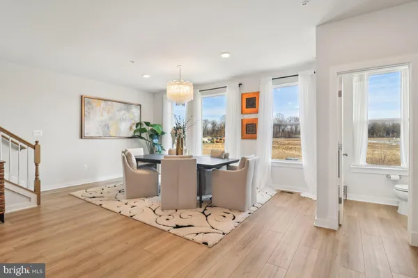 a view of kitchen and dining room with wooden floor