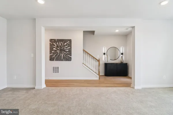 a bedroom with a bed and a lamp on table