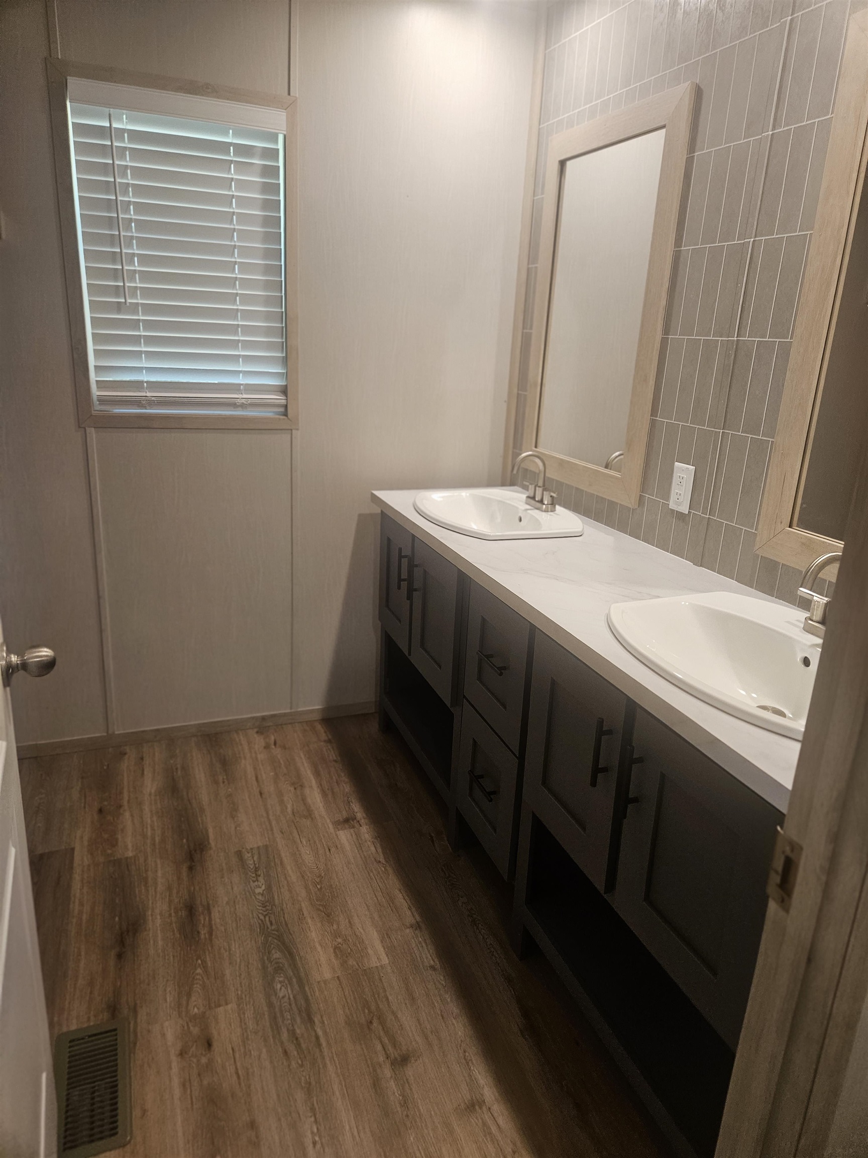75 Pittman Road, Unit ROAD Somerville, TN 38068 - Photo 17 of 26 Dual vanity featuring integrated sinks, dark cabinetry, and light countertops