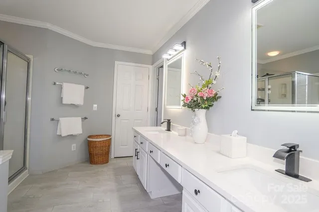 a spacious bathroom with a double vanity sink mirror and