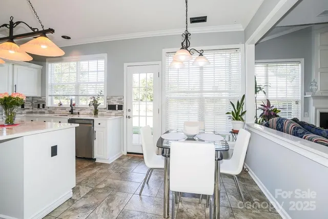 a kitchen that has a lot of cabinets in it
