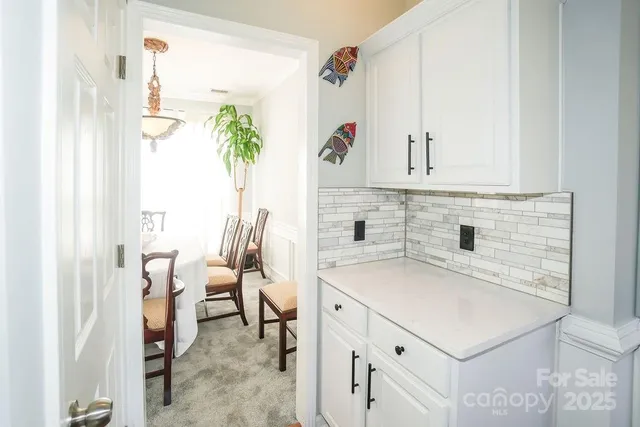 a kitchen with a sink cabinets and a window