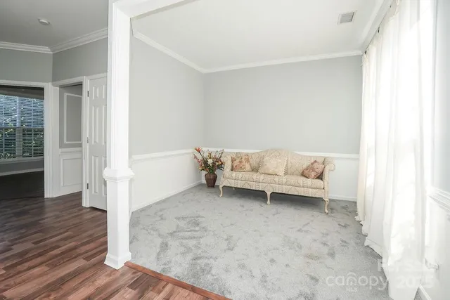 a living room with a couch and a rug