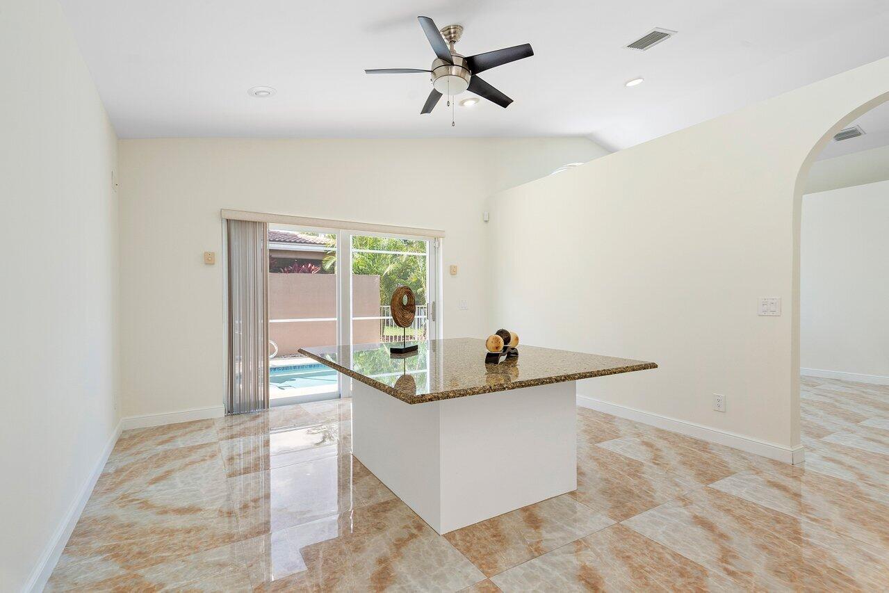 9547 Fox Trot Lane Boca Raton, FL 33496 - Photo 12 of 38 a living room with a rug